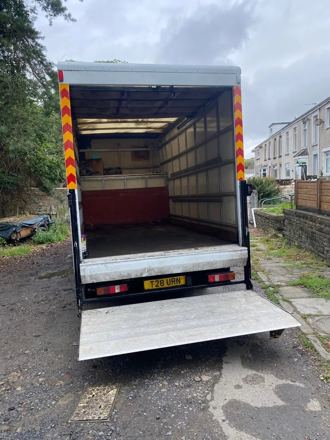 Open empty Luton van with tail lift